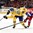 TORONTO, CANADA - JANUARY 4:  Swedenâ€™s Oskar Lindblom #22 pulls the puck away from Russiaâ€™s Ziat Paigin #4 during semifinal round action at the 2015 IIHF World Junior Championship. (Photo by Richard Wolowicz/HHOF-IIHF Images)